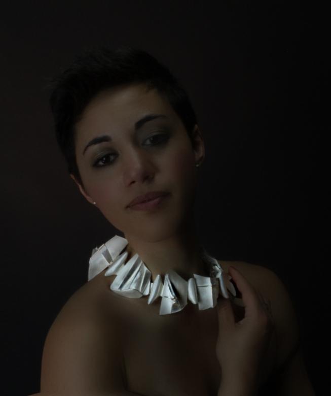 A Woman Wearing a Spike Shaped Necklace