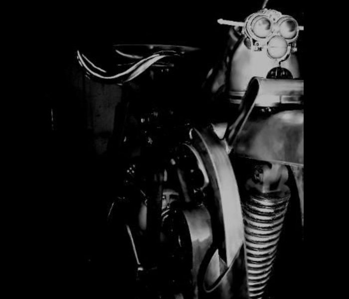 A black and white photograph of a motorcycle.