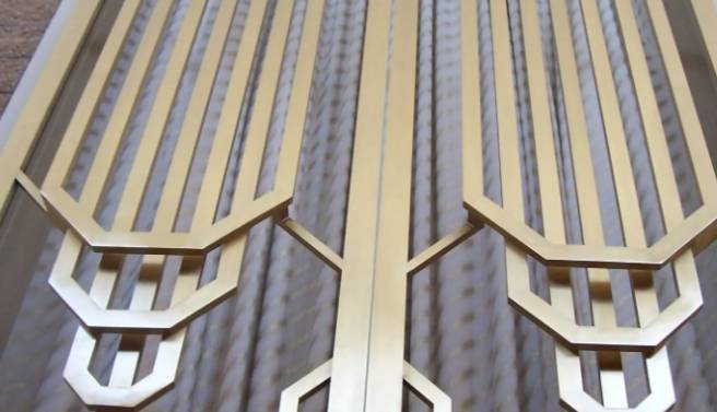 A close-up of a metal fence designed by Ira Sherman.