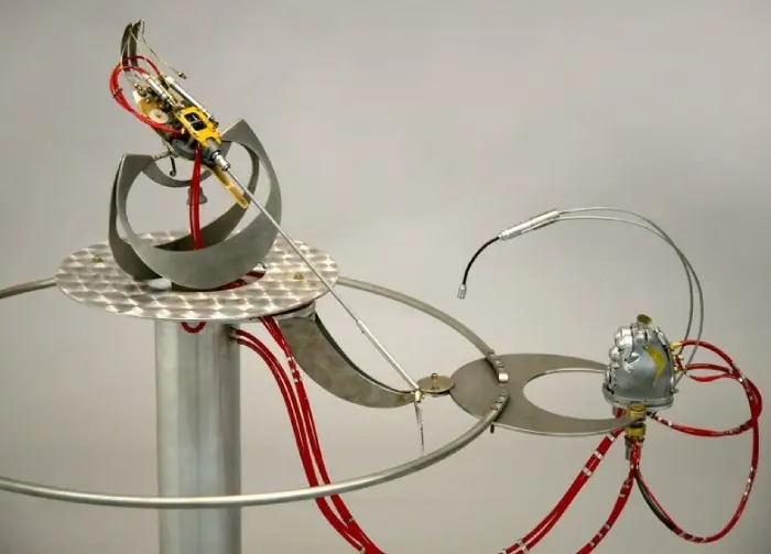 A machine with wires and a circular object.
