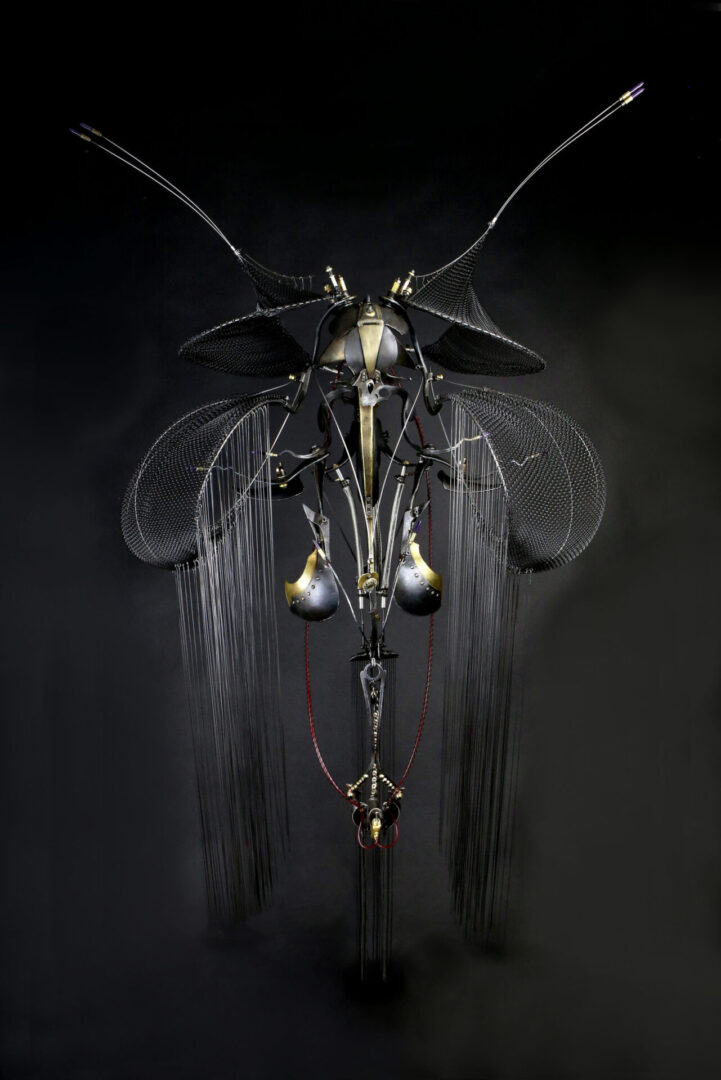 An interactive sculpture of a beetle on a black background.