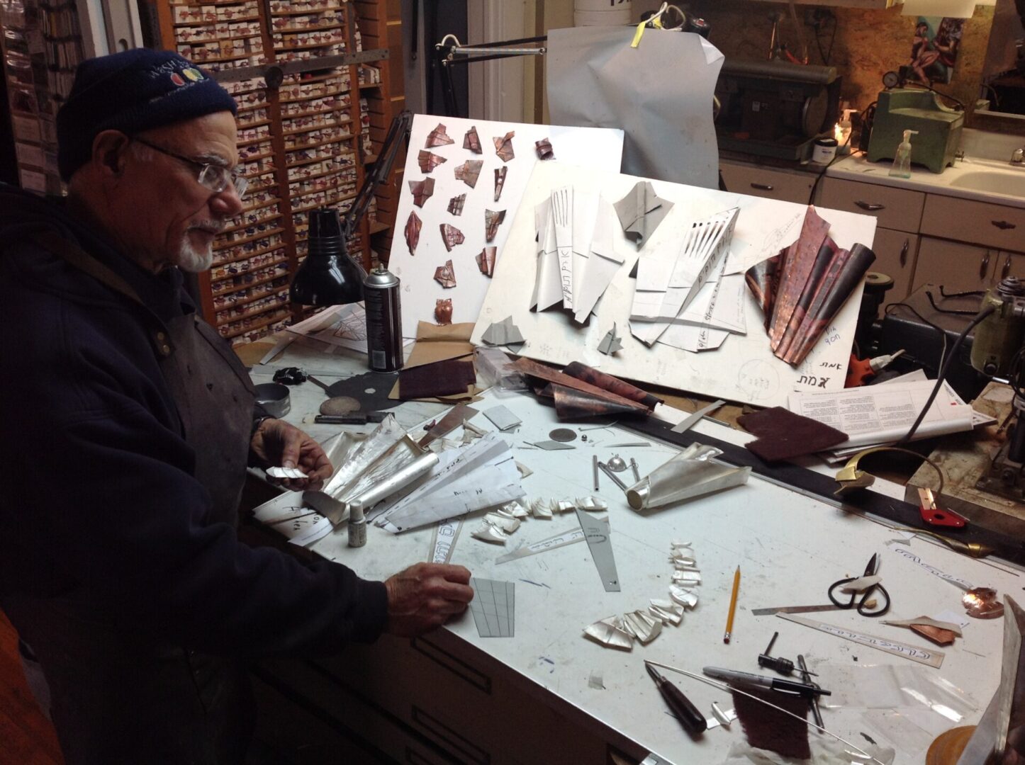 A man working in the Ira Sherman Jewelry workshop.