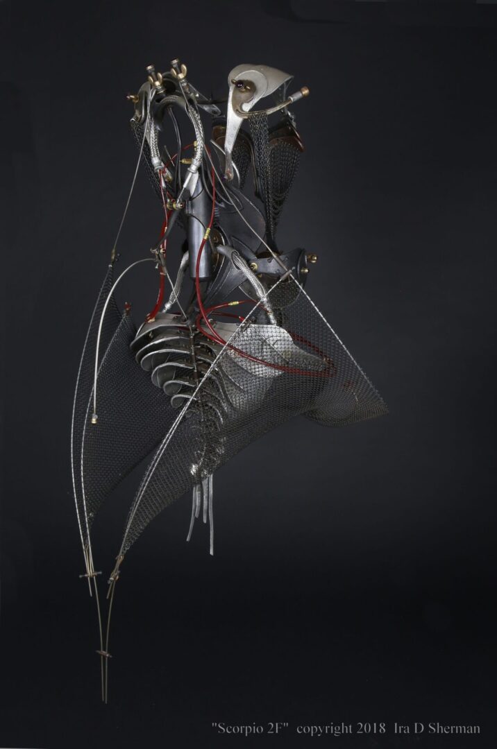A sculpture of a bird with wires attached to it.