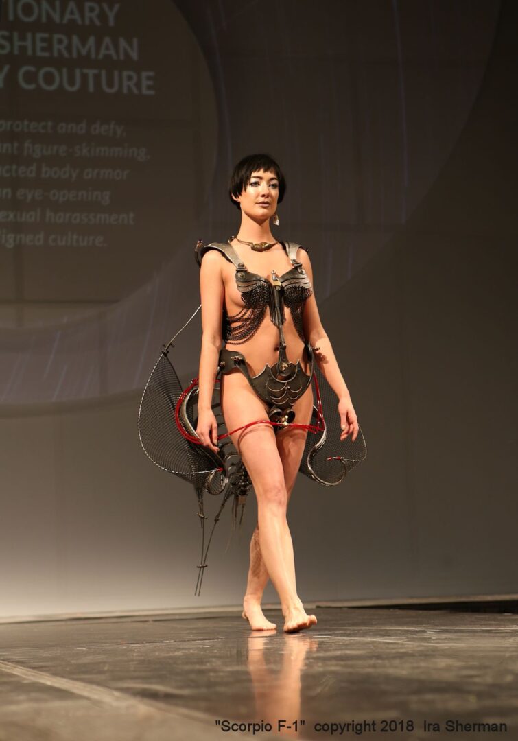 A woman in a bikini walking down the runway.