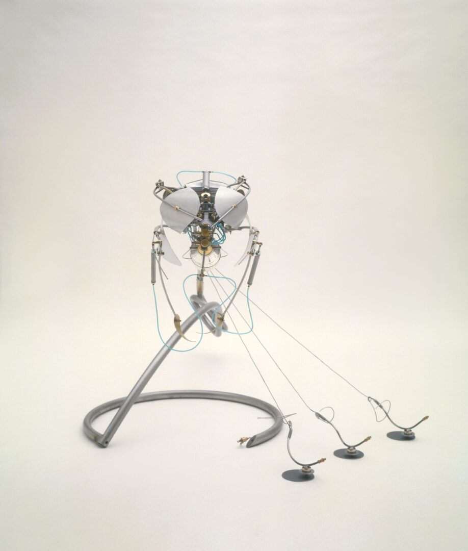 A sculpture with two wires attached to it.