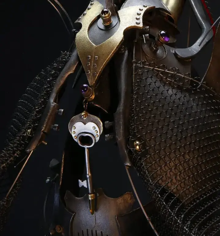 A steampunk robot adorned with a mesmerizing key, featured in Ira Sherman Traveling Exhibitions.