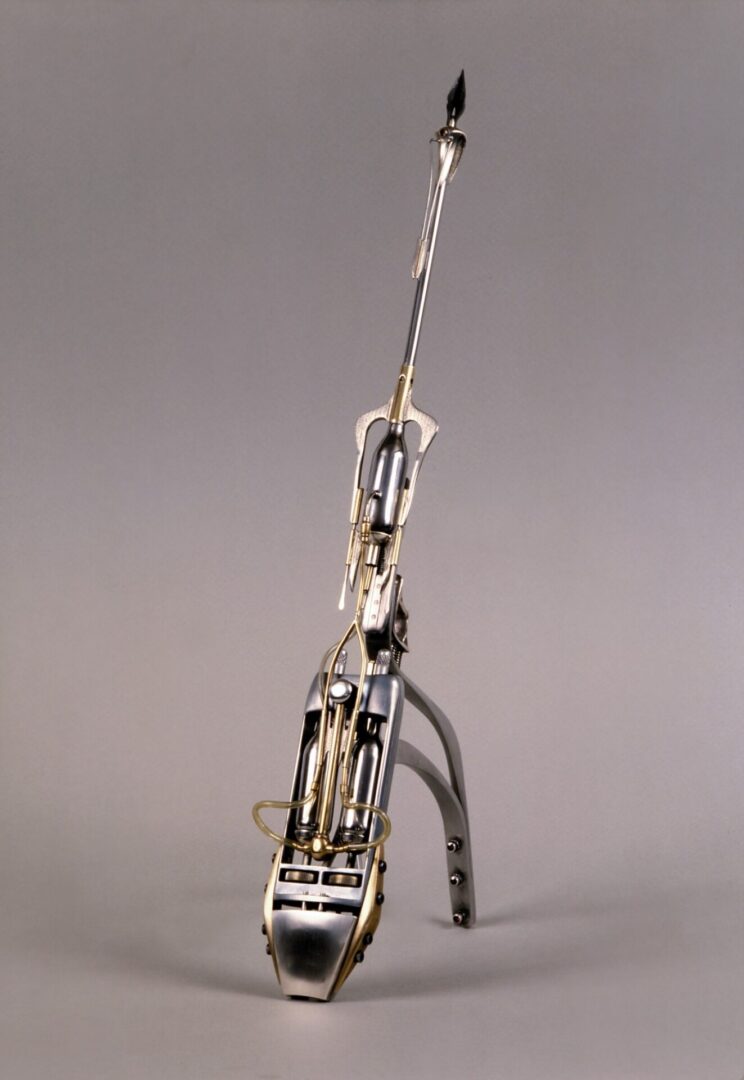 A model of a musical instrument on a grey background.