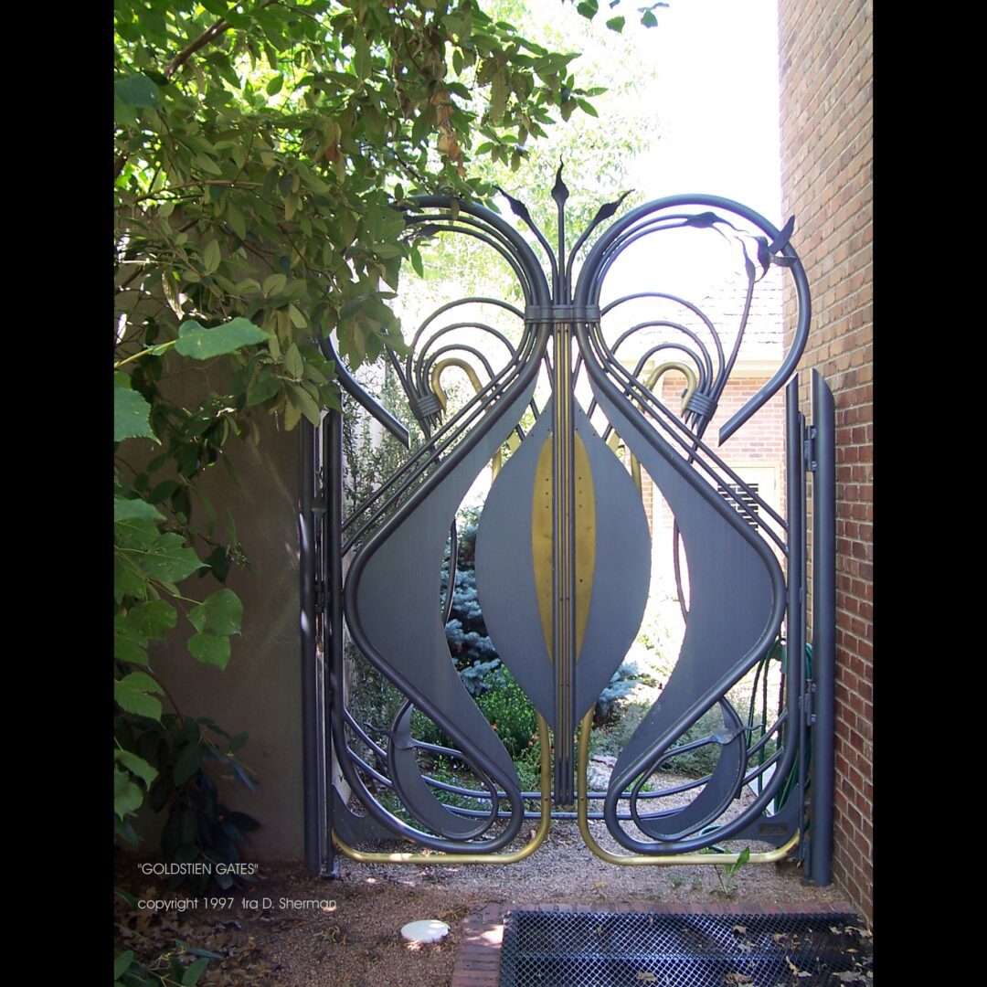 A metal gate with a design on it.