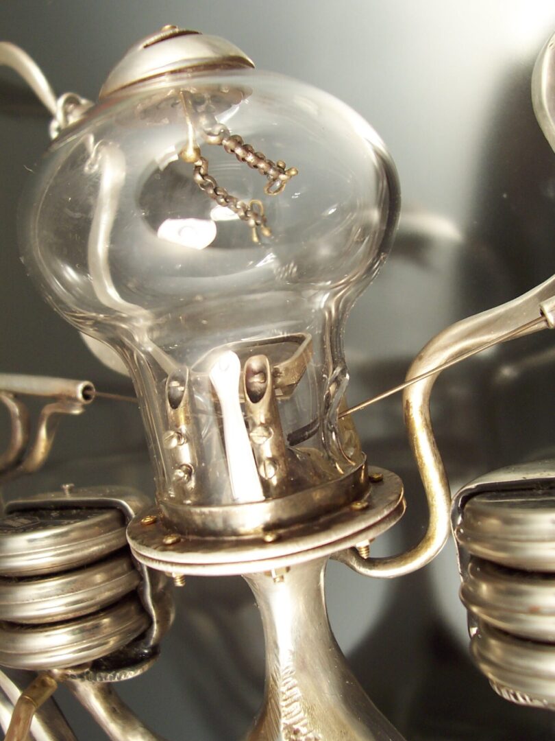 A close up of a silver light bulb.